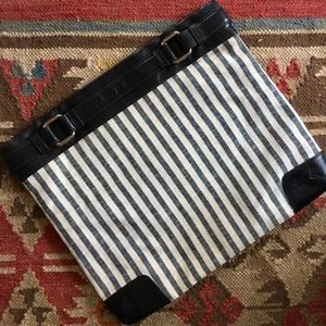 Navy striped fold-over clutch.